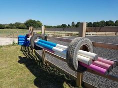 there are many different colored hoses attached to the fence