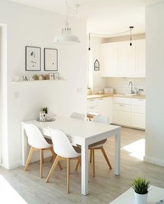 a white table and chairs in a room