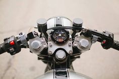 the handlebars and gauges are visible on this motorcycle's front end