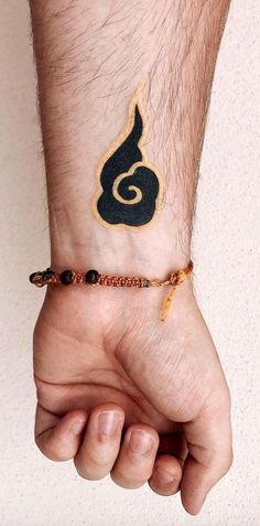 a person with a tattoo on their wrist