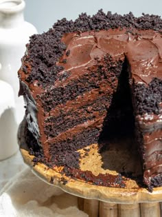 a chocolate cake with one slice missing from it