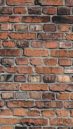 an old brick wall is shown in this image