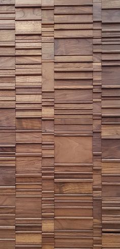 a wooden wall made up of many different types of boards