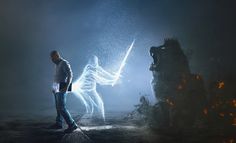 a man standing next to a fire hydrant in the middle of a dark room