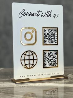 a white and gold business card holder with qr code on the front that says connect with us