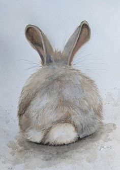 a painting of a rabbit's head resting on the ground