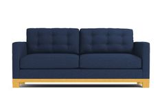 a blue couch sitting on top of a white floor