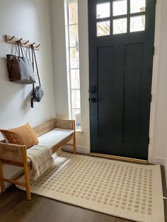 Entry way Chris Loves Julia Loloi Rug, Layered Entryway Rugs, Chris Loves Julia Loloi, Hallway Rugs Ideas, Foyer Rugs Entryway, Rugs Layout, Apartment Entry, Tiny Entryway, Purse Rack