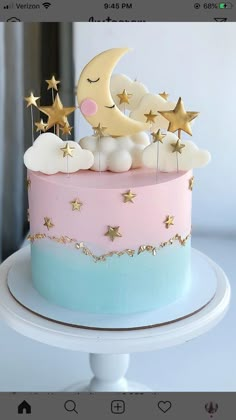 a cake with stars and moon decorations on top