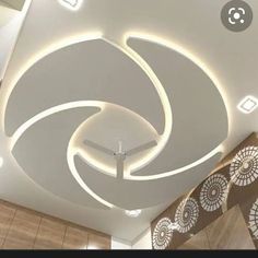 the ceiling is decorated with white lights and circular designs