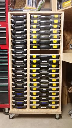 the shelves are filled with many different types of toolboxes and other tools on wheels