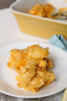 a white plate topped with food next to a yellow bowl filled with batter on top of it