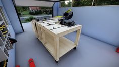 a workbench with tools on it in the middle of a room filled with construction equipment