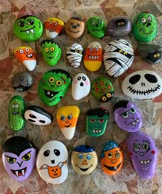 there are many painted rocks with faces on them