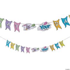 a happy birthday banner hanging from a string on a clothes line with the words, your day