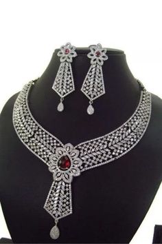 Gift Bridal Sets With Diamond Cut Crystal, Red Sterling Silver Bridal Necklace For Wedding, Exquisite Silver Diamond Cut Jewelry Sets, Classic Cubic Zirconia Necklace With Intricate Design, Exquisite Silver Round Cut Bridal Necklace, Exquisite Silver Bridal Necklace, Elegant Crystal Jewelry With Intricate Design, Elegant Red Jewelry With Brilliant Cut, Elegant Red Bridal Sets For Formal Occasions