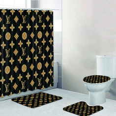 a bathroom with black and gold decor on the shower curtain, toilet seat covers and rugs