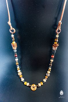 "A beautiful unisex boho necklace, perfect for men and women. It has a very oriental / Indian vibe to it. Great for any occasion. The full length is 80 cm, so reaches the solar plexus as in the photos above. It's a fixed size. Feel free to contact me if you prefer a different size! This one is another of my special pieces that have bits from all over the world! The pendant is made of wood in an African Style, and the beads are from all over the world: Rudrashtaka seeds from India, Tiger eye ston Hand-strung Hippie Jewelry For Meditation, Hippie Hand-strung Jewelry For Meditation, Beaded Bohemian Necklaces, Everyday Bohemian Jewelry, Handmade Round Beads Jewelry For Everyday Use, Handmade Jewelry With Round Beads For Daily Use, Hippie Hand-strung Necklaces For Festivals, Traditional Handmade Jewelry For Everyday Use, Spiritual Necklaces With Large Adjustable Beads