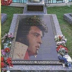 the elvis presley memorial is surrounded by flowers