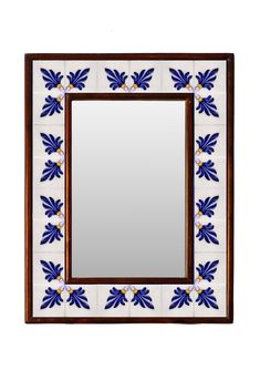 a mirror with blue and white designs on the front, hanging from a wooden frame