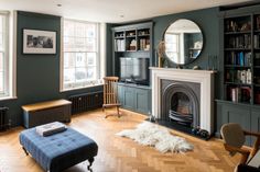 a living room filled with furniture and a fire place