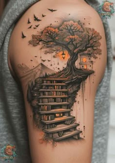 a woman's arm with a tree and books on it