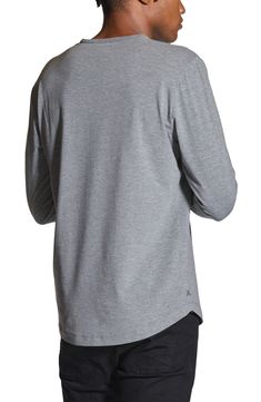 Made from a soft cotton blend, a versatile long-sleeve T-shirt enhanced with a curved hem is an instant closet favorite that looks great alone or layered. Crewneck Long sleeves 62% polyester, 33% cotton, 5% spandex Machine wash, tumble dry Imported Casual Long Sleeve Top With Shirttail Hem For Layering, Long Sleeve T-shirt For Layering With Relaxed Fit, Curved Hem Tops For Fall Layering, Casual Tops For Layering With Curved Hem, Fall T-shirt With Shirttail Hem, Heather Grey Cotton Crew Neck T-shirt, Stretch Elastane Long Sleeve T-shirt, Athletic Heather Long Sleeve Cotton T-shirt, Gray Long Sleeve Moisture-wicking T-shirt