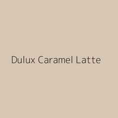 the words dulux caramel latte are shown in black on a beige background