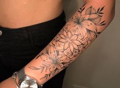 a woman's arm with a flower tattoo on the left side of her body