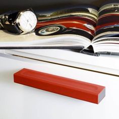 an open book sitting on top of a white desk