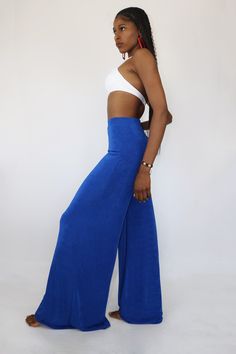 Make a bold fashion statement at work and on the weekends with these eye-catching wide legged pants. This bold pair of pants is a versatile choice that can be worn with a variety of tops whether printed or solid. They are made with a wide leg that is sure to flow flawlessly while headed to brunch or on a date night. These pants are very comfortable and are made of the classic 80's slink fabric. The bold blue color is always a staple for the warmer seasons and a versatile option that will look pe Wide Legged Pants, Pants Large, Pair Of Pants, Bold Fashion, Medium Blue, Fashion Statement, Wide Leg Pants, Date Night, Wide Leg