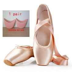 two pairs of pink ballet shoes with ribbon around the toe and one pair of pink ballet shoes