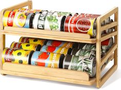 a bamboo spice rack with six different types of spices in it and one on the bottom shelf