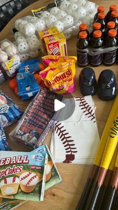 baseball items are laid out on a table with pencils, candy and other sports related items