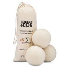 three wool dryer balls in a bag