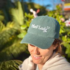 New Plant Lady Hat! This stylish accessory is perfect for any gardener , plant lady or plant lover. Made from durable and breathable cotton, this hat will keep the sun off your face and head while you tend to your garden. The front of the hat features an embroidered design of a plant lady, making it a perfect addition to any outdoor outfit. The Plant Lady Hat is available in one size fits all. It's perfect for plant lovers looking to show off their passion for plants in their everyday wear. Lady Hat, Womens Baseball Cap, Plant Lady, Great Christmas Gifts, Outdoor Outfit, Embroidered Design, Plant Lover, Stylish Accessories, One Size Fits All