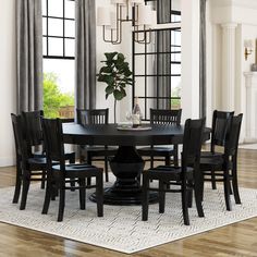 a dining room table with chairs around it