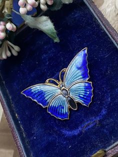 Fabulous butterfly brooch dating from the later Art Deco period 30's-40's period set in gold tone with the most wonderful colours of blue cold enamel set in her wings with a black head & body. A wonderful example of fun bug jewellery popular of the era with lots of history. Measuring 3.8 cm by 2.5 cm with original c clasp.   Please note all boxes and decorations are for display only and not included in the listing.  All items are of at least antique or vintage era unless otherwise stated and the Art Deco Blue Brooches As Gifts, Vintage Formal Enamel Pin Brooch, Luxury Antique Enamel Pin Brooch, Vintage Enamel Evening Brooches, Art Nouveau Enamel Brooch Jewelry, Butterfly Brooch, Art Deco Period, Vintage Art Deco, Brooch Pin