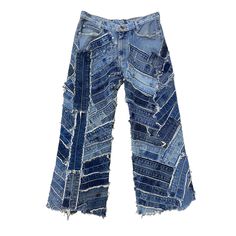 a pair of blue jeans with holes in the bottom and side, on a white background