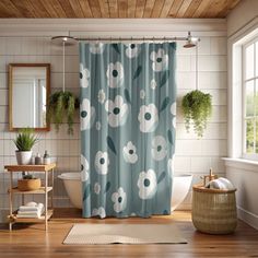 a bathroom with a shower curtain and rug