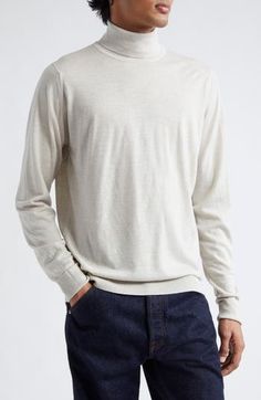 The English label's commitment to understated luxury informs the design of this supremely soft turtleneck sweater crafted from extrafine merino wool. 27 1/2" length (size Medium) Turtleneck Long sleeves 100% merino wool Dry clean or machine wash, dry flat Made in the UK Men's Designer Clothing Classic Merino Wool Turtleneck Sweater, Crew Neck Cashmere Turtleneck For Layering, Cashmere Crew Neck Turtleneck For Layering, Beige Wool Turtleneck Top, Wool Turtleneck With Ribbed Collar And Long Sleeves, Classic Wool Turtleneck Top, Casual Wool Fine Knit Turtleneck, Casual Fine Knit Wool Turtleneck, Wool Long Sleeve Turtleneck For Layering