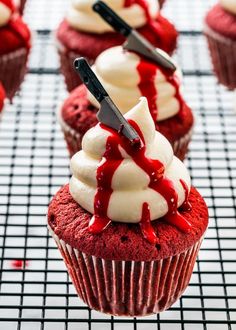 some red velvet cupcakes with white frosting