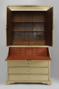 an old wooden chest with drawers on top