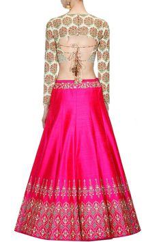 This set features a mint blouse with persian floral print and keyhole cutout detailing on the neckline and silver threadwork and zari work around the hem.It has a deep cut out back with dori string. It is paired with a hot pink lehenga in dupion blue and silver zari and sequins work in floral motifs around the hem and waist. It has red dori tie up with wooden lotus and flower tasseled hangings.It has an underlayer of pink can can. It comes along with mintgreen net dupatta with mokesh and sequins Pink Wedding Lehenga, Hot Pink Lehenga, Lehenga Styles, Bandana Designs, Lengha Blouse, Blouses Pattern, Hot Pink Wedding, Jacket Lehenga, Mint Blouse