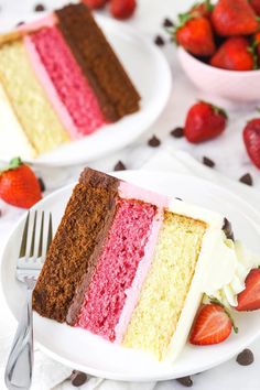 a slice of cake on a plate with strawberries