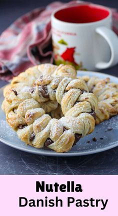 nutella danish pastry on a plate with a cup of coffee in the background and text overlay