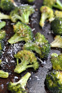 broccoli florets are being cooked in a pan with salt and pepper