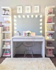 a white desk topped with a mirror and lights