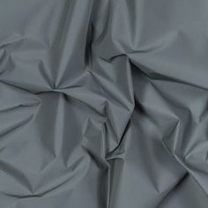 an up close shot of a gray fabric