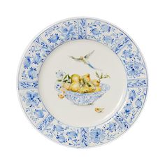 a blue and white plate with birds on it